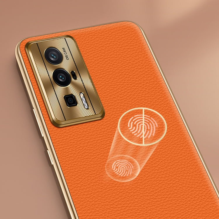 Orange textured genuine leather phone case with fingerprint pattern