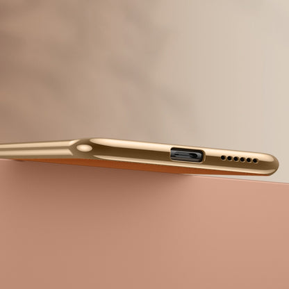 Orange leather phone case side view with buttons and port cutouts