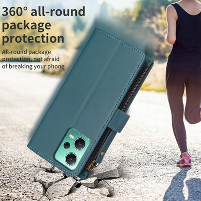 Teal leather flip phone wallet with zipper, card slots, and front phone window.