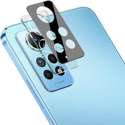 Black integrated glass lens film with cutouts aligned to phone cameras