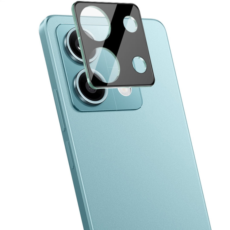 Black integrated glass camera lens film with cutouts for dual lenses