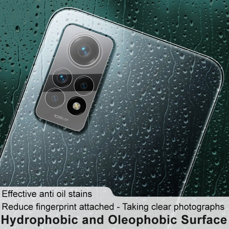 Tempered glass camera lens film over rear camera module with lens outlines