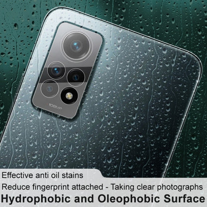 Tempered glass camera lens film over rear camera module with lens outlines