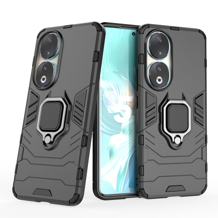 Black TPU phone case with magnetic ring holder and raised camera protection