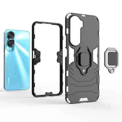 Black rugged phone case with magnetic ring holder; open ports and camera cutout