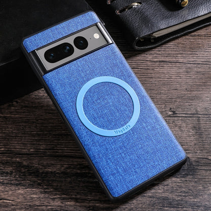 Blue fabric-texture phone case with light-colored MagSafe magnetic ring on back