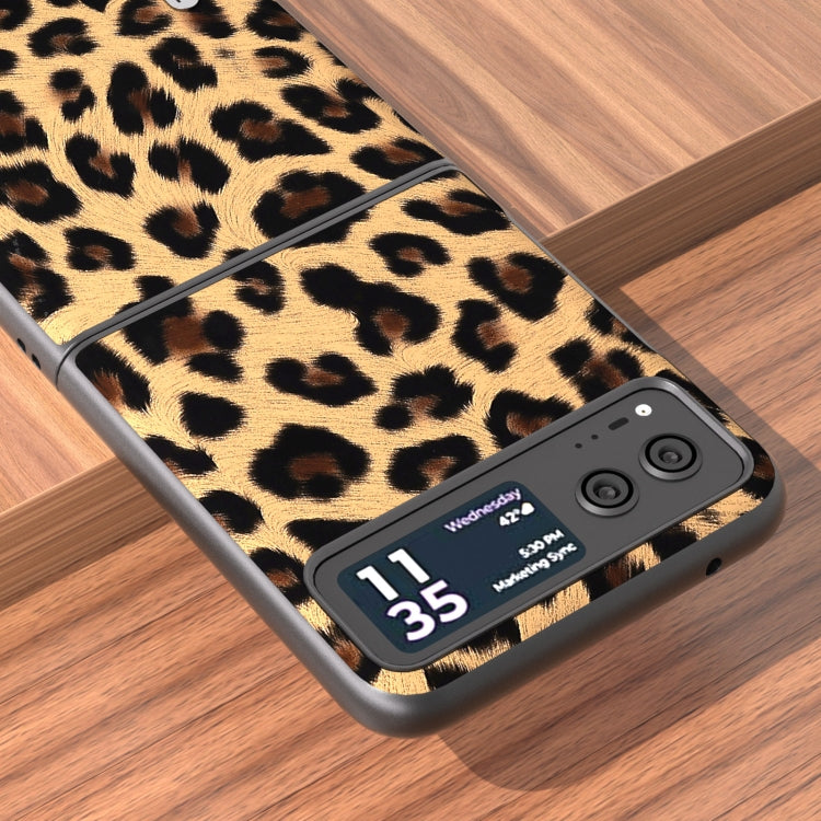 Leopard print phone case with black border and raised camera cutout on back