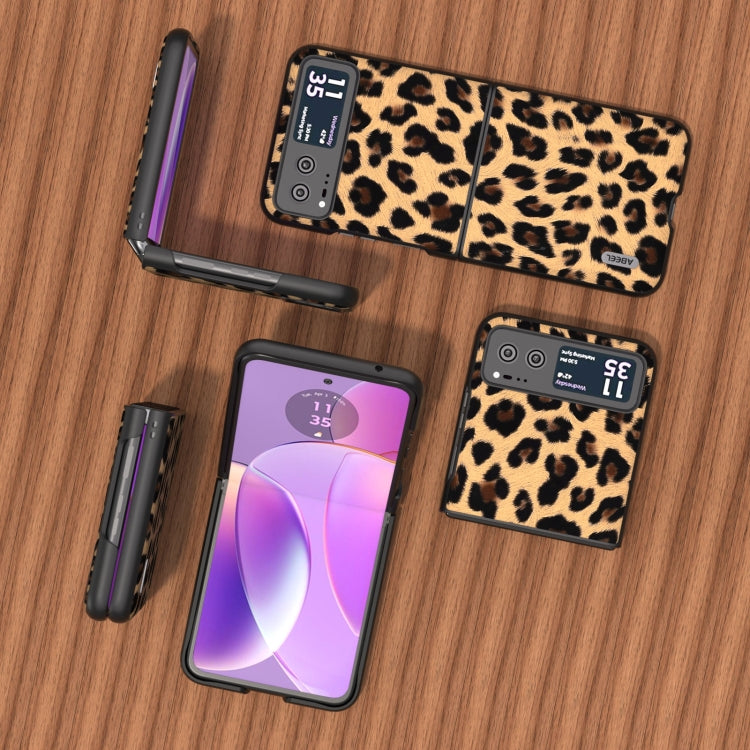 Leopard print phone case set with built-in stand and black edging, shown with phone