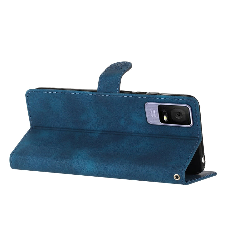 Blue leather-look folio phone case with wrist strap and embossed butterfly-flower design