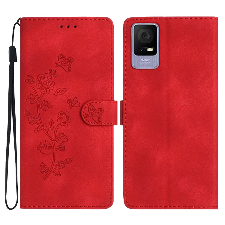 Red leather-look phone case with embossed flowers and butterflies, wrist strap and cutout