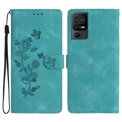 Teal leather folio phone case with embossed butterfly and flower pattern, flip strap included