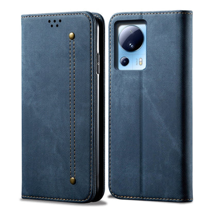 Blue flip phone case with denim texture, leather-look edges and camera cutout