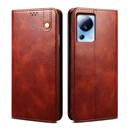 Brown leather phone case set with camera cutout on back and magnetic button on front