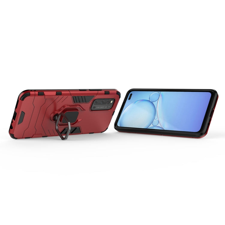 Red armor case with ring holder, angled side view with phone screen showing