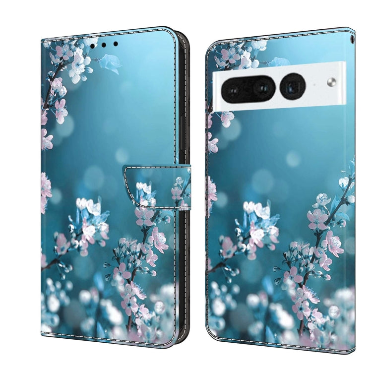 Wallet-style phone case with light blue background and pink blossom floral print