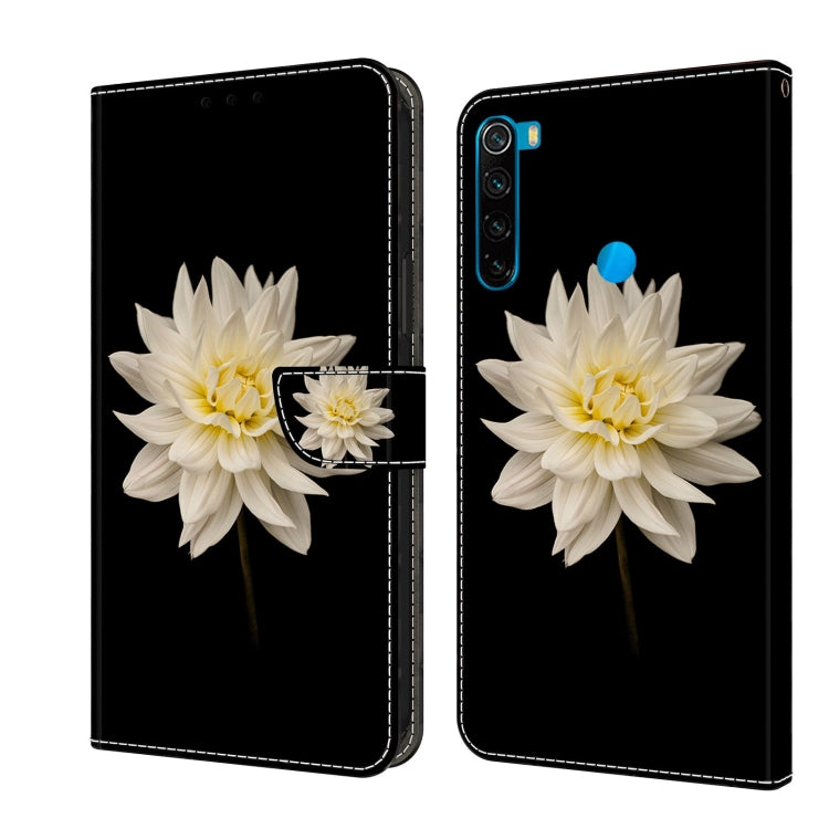 Leather flip phone case with white flower and small blossom accent on dark cover.