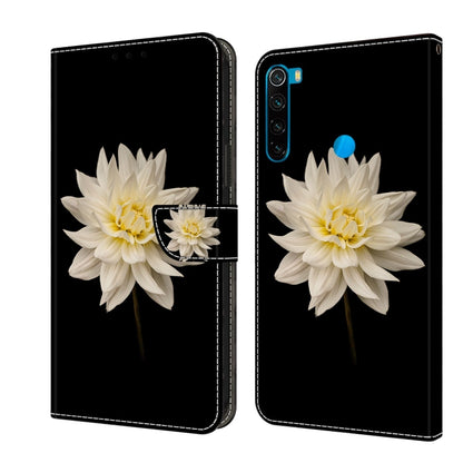 Leather flip phone case with white flower and small blossom accent on dark cover.
