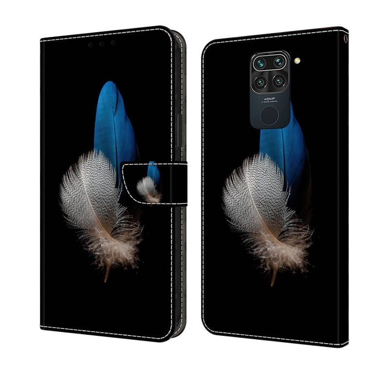Flip phone case with blue and white feather print on dark background