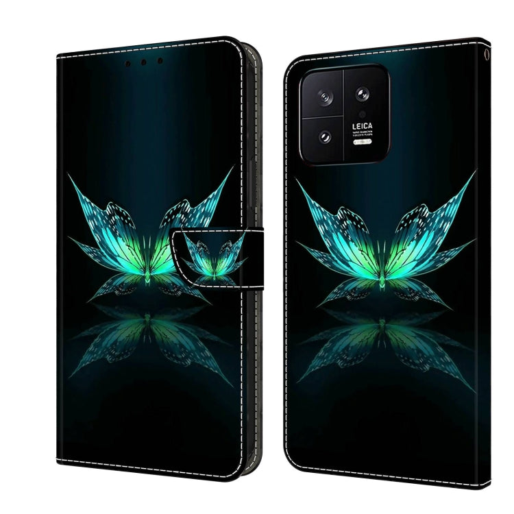 Black leather wallet phone case with teal glowing flower-and-butterfly crystal art