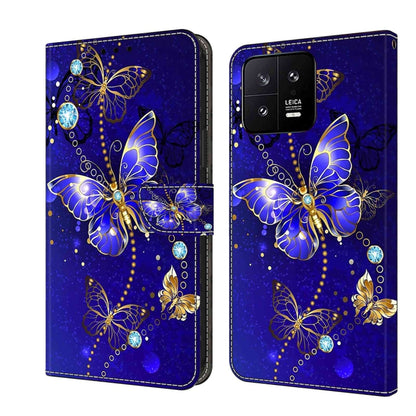 Leather phone case with blue butterfly, gold accents, and crystal-like gems on a dual cover.