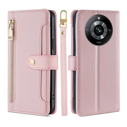 Pink cross-body zipper wallet phone case with front card slot and wrist strap.