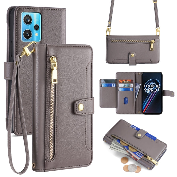 Gray leather cross-body phone wallet with front zipper, card slots, and wrist strap