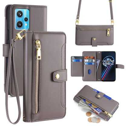 Gray leather cross-body phone wallet with front zipper, card slots, and wrist strap