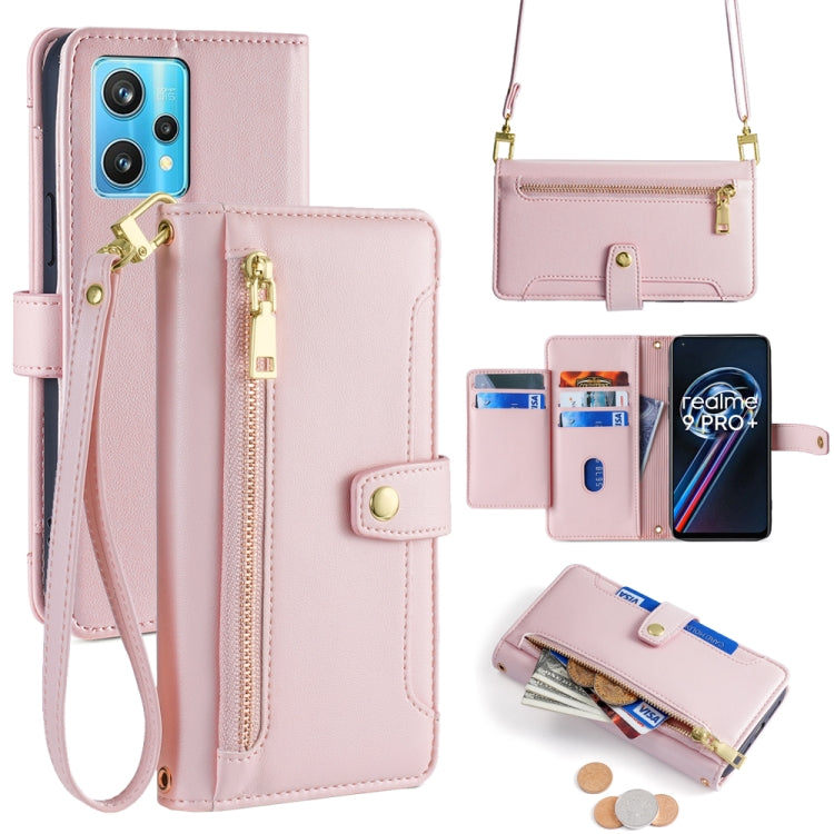 Pink leather cross-body phone wallet with front zipper, card slots, and wrist strap