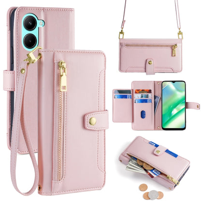 Pink cross-body phone wallet with zipper, card slots, and wrist strap