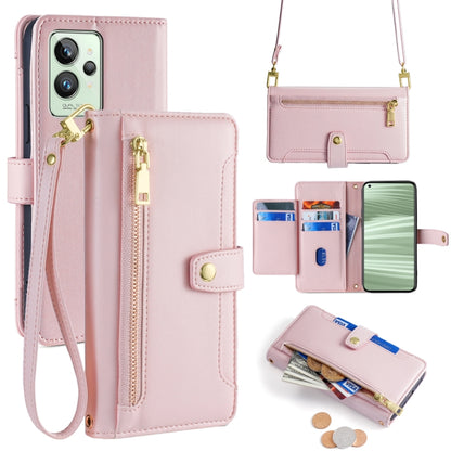 Pink cross-body wallet phone case with zip pocket and wrist strap