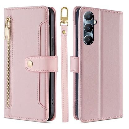 Light pink cross-body zipper wallet phone case with front card slot and wrist strap.