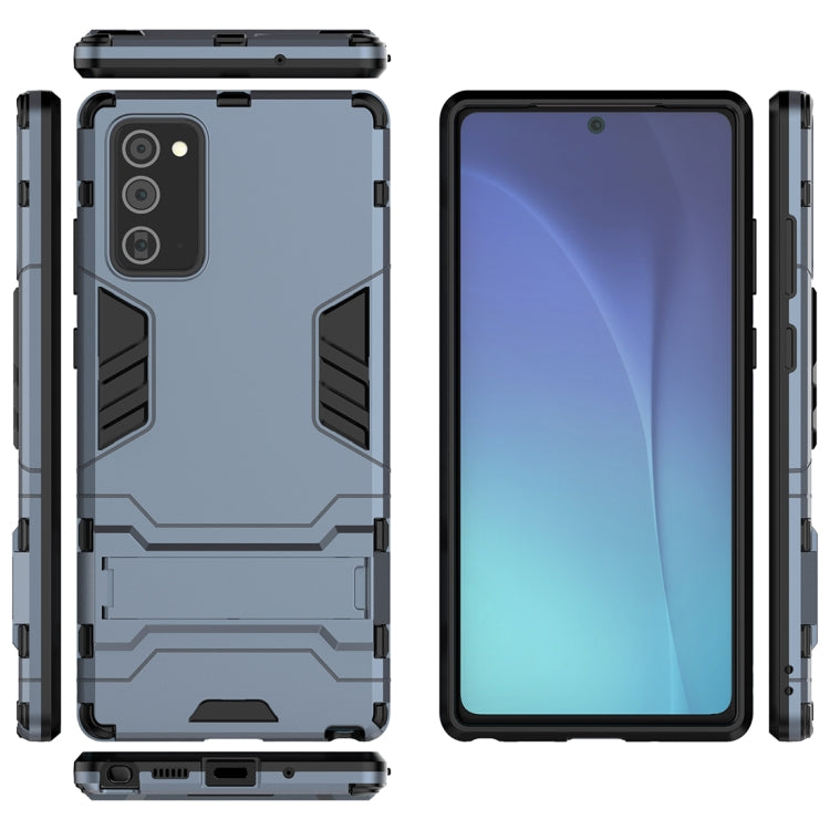 Light blue-gray rugged case shown front, back, and side with camera openings