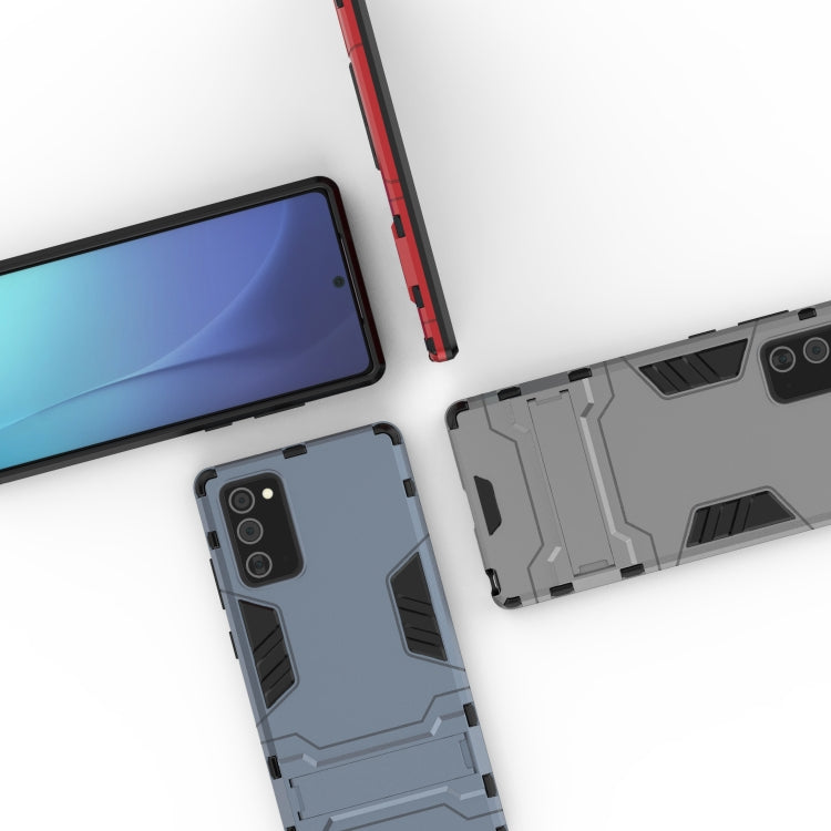 Light blue-gray case detail with camera cutout and textured grip panels
