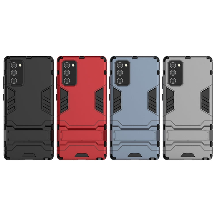 Set of rugged phone cases in black, red, and light blue-gray with camera cutouts