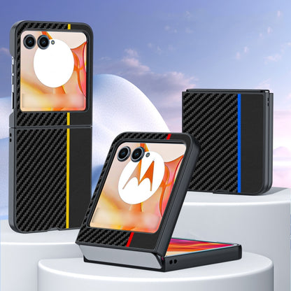 Black carbon-fiber phone case with orange graphic and yellow accent lines, dual camera cutouts