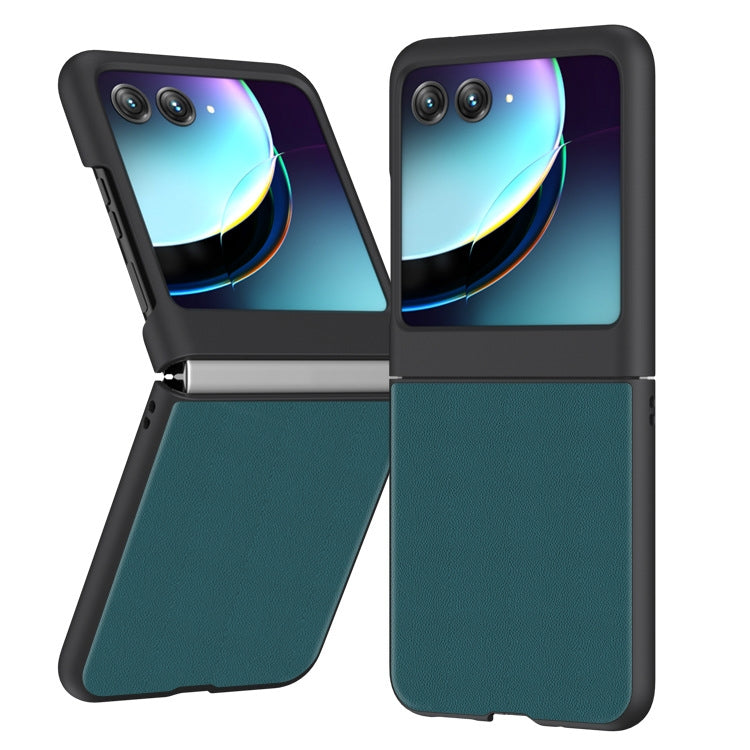 Dark green leather flip phone case with camera cutouts, front cover closed