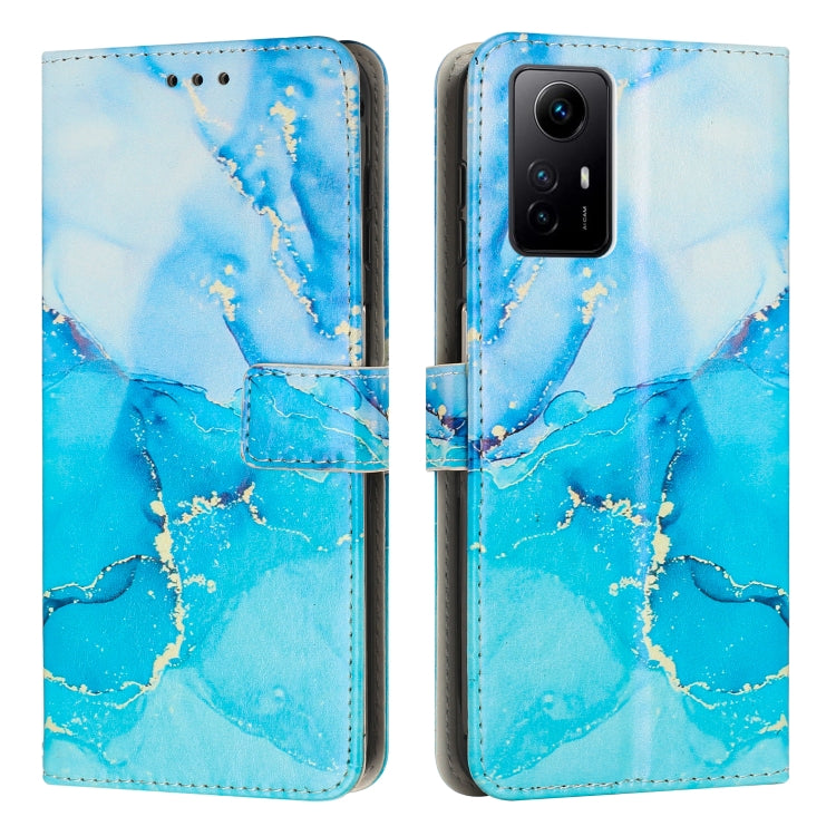 Light blue and teal painted marble pattern leather phone case with magnetic flap.