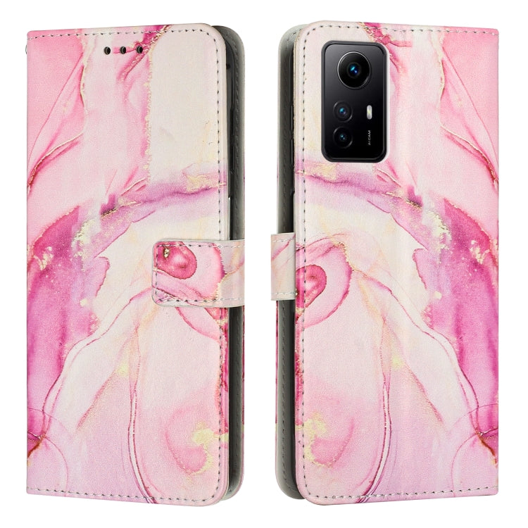 Rose pink painted marble pattern leather phone case with magnetic flap and cutouts.