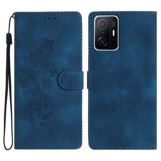 Blue leather phone case with embossed flowers and butterflies, folio style and wrist strap