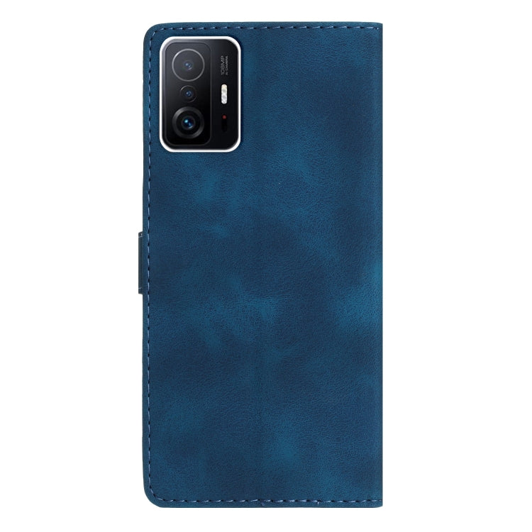 Blue leather phone case with camera cutout and stitched edges