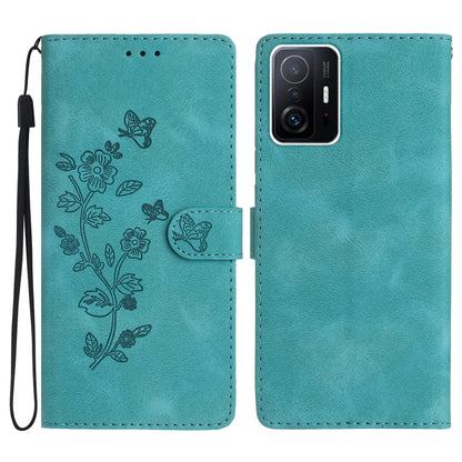 Teal leather phone case with embossed flowers and butterflies, folio style and wrist strap