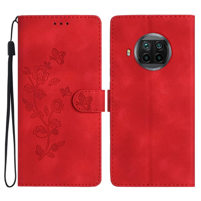 Red leather folio phone case with embossed flowers and butterflies, wrist strap and camera cutout