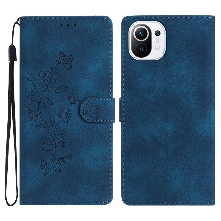 Blue leather phone case with embossed flower and butterfly pattern, folio with flap