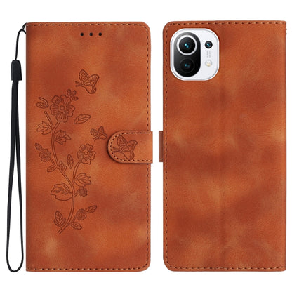 Orange leather phone case with embossed flowers and butterfly, flip cover, wrist strap