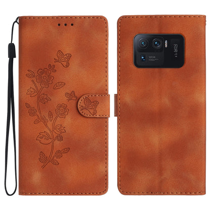 Orange leather phone case with embossed flowers and butterfly, flip cover and camera cutout