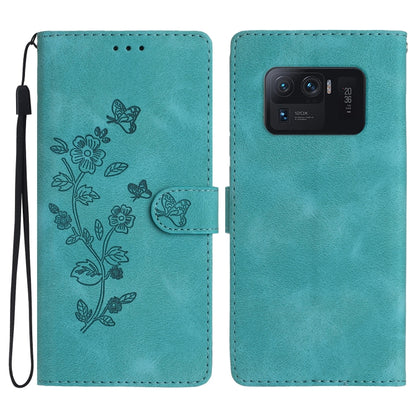 Teal leather phone case with embossed flowers and butterfly, flip cover and camera cutout