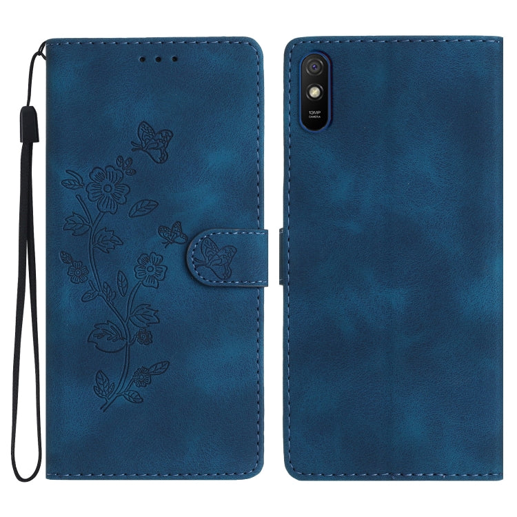 Blue leather wallet phone case with embossed floral and butterfly pattern, flip cover, wrist strap