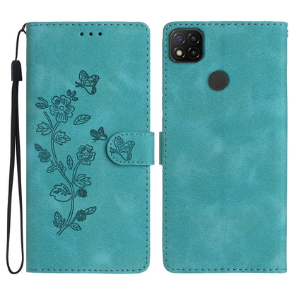 Sky blue embossed leather phone case with butterfly-flower pattern, wrist strap, flip cover.