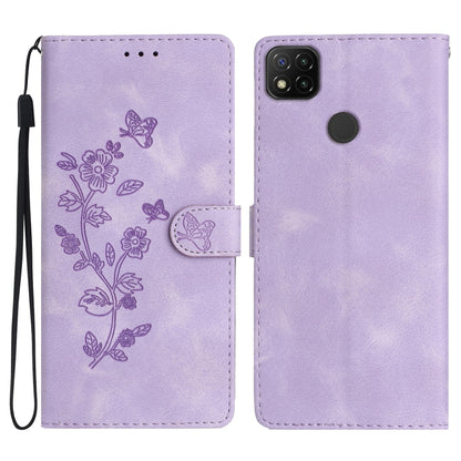 Purple embossed leather phone case with butterfly-flower pattern, wrist strap, flip cover.