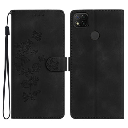 Black embossed leather phone case with butterfly-flower pattern, wrist strap, flip cover.